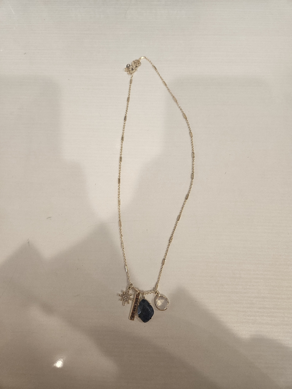 Gold Tone Multi-Charm Necklace with Blue Stone and Clear Crystal